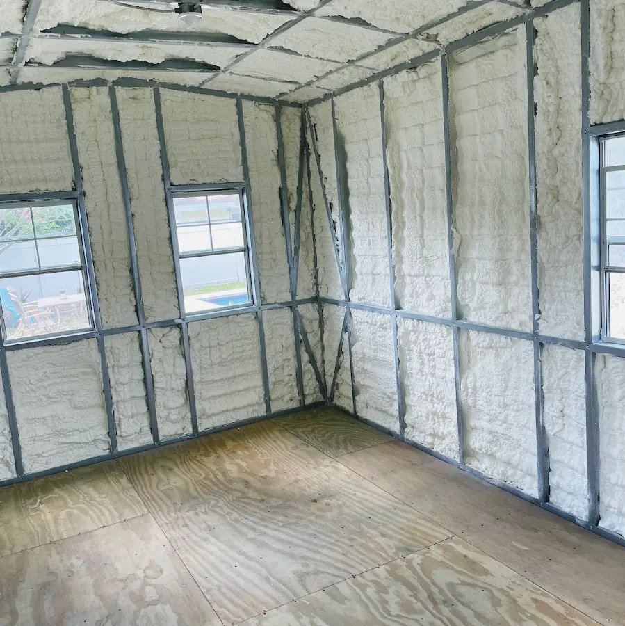 Closed-cell spray foam insulation applied to wall cavities in a residential project in Watertown